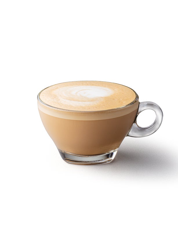 A flat white in a glass cup