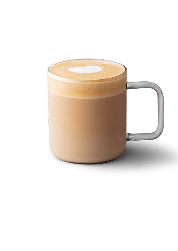 A caffè latte in a glass mug