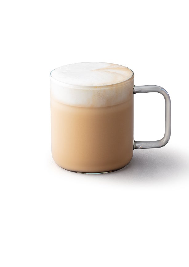 A cappuccino in a glass mug