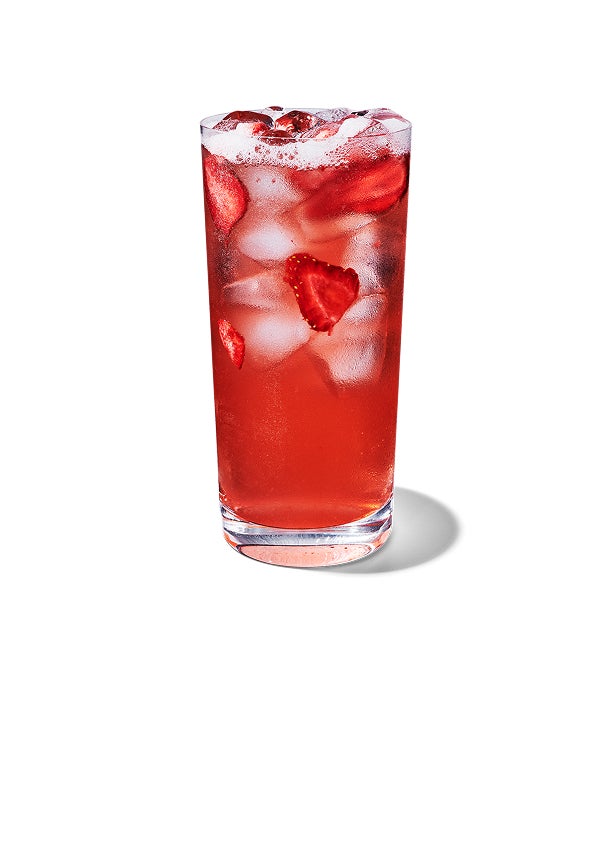 A Strawberry Açai Starbucks Refresha® Drink in a tall glass