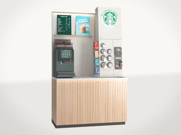The We Proudly Serve Starbucks self-serve solution in tall: self-serve coffee machine and counter