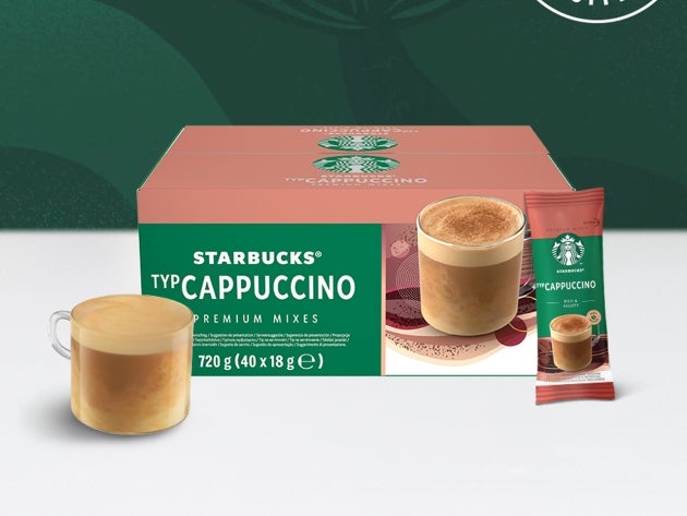 Starbucks® Cappuccino Premium Instant Coffee in a glass mug, displayed alongside a sachet and package